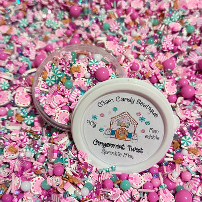 Pink and mint fake candy sprinkles with a container labeled 'Glam Candy Boutique' on a pink background.